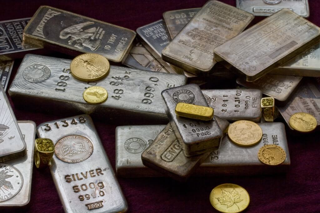 Gold and Silver Bullion on table