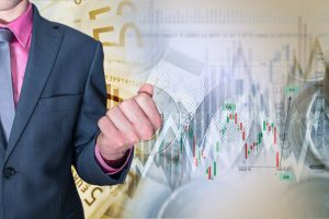 Business Person in front of stock chart representing brexit effect
